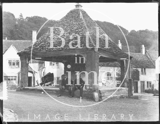 Two gentlemen posing under the Market Cross, Castle Combe, Wiltshire c.1900