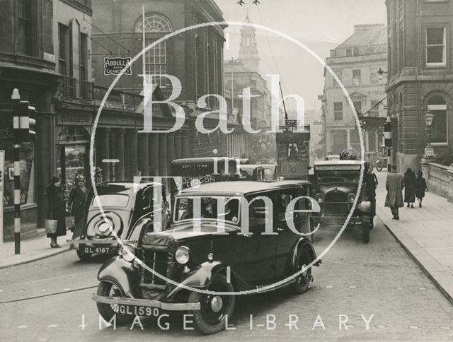 Stall Street looking south with lots of traffic, including trams, Bath c.1930