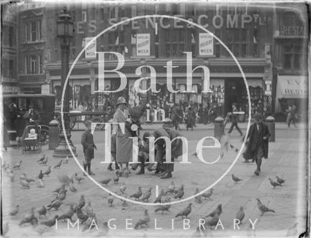 Feeding the pigeons during a trip to London 1926