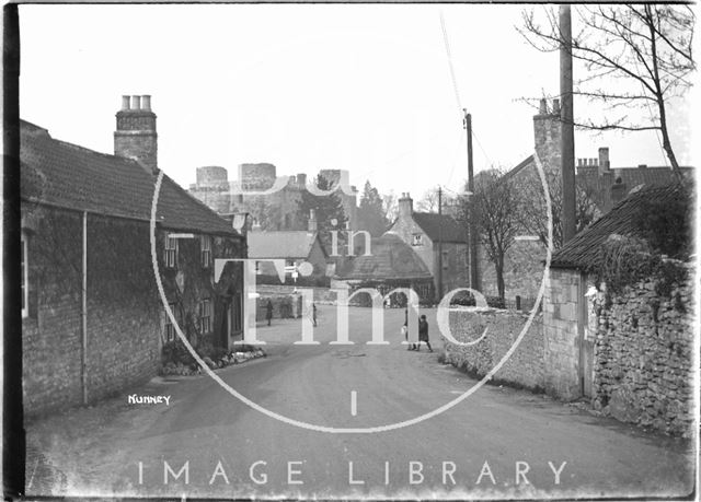 View down the street towards Nunney Castle, Somerset c.1920