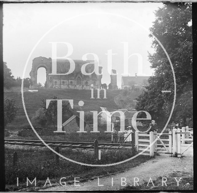 View of Malmesbury Abbey, Wiltshire across the railway line c.1900