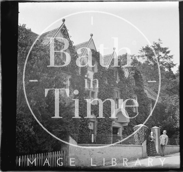 Castle Combe, Wiltshire with figures in the foreground c.1900