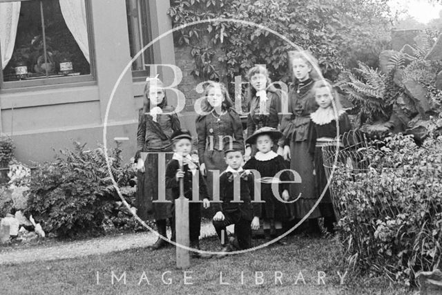 Detail of a family portrait outside an unidentified building c.1900