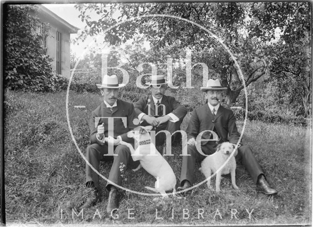 Three Gentlemen and two dogs in the grounds of an unidentified house c.1910