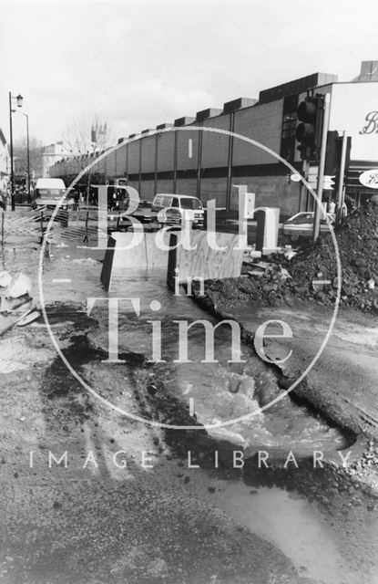 A burst water main at the junction of Southgate Street and Dorchester Street, Bath 1992