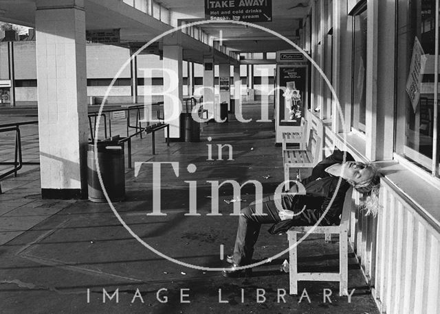 A girl slumped on a bench at the old bus station, Bath c.1980