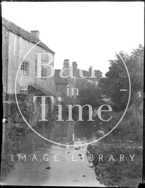 Houses in Nunney, Somerset, viewed across the stream c.1900