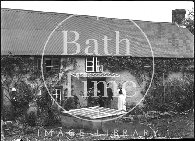 George Hutchings and his post clerk daughter Susie in the rear garden of the post office, Middle Street, Rimpton, Somerset c.1900