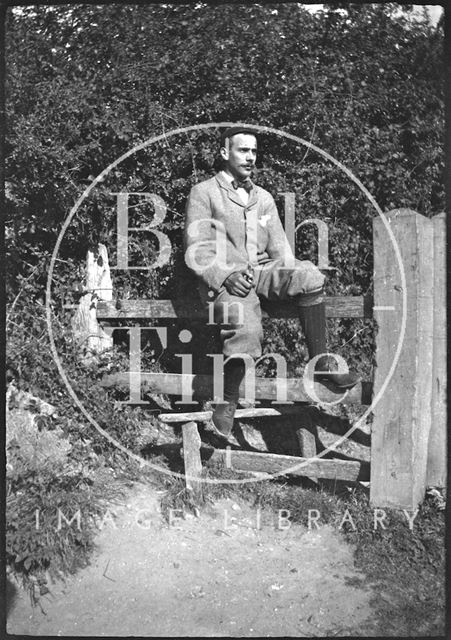 Cyclist on a stile c.1900