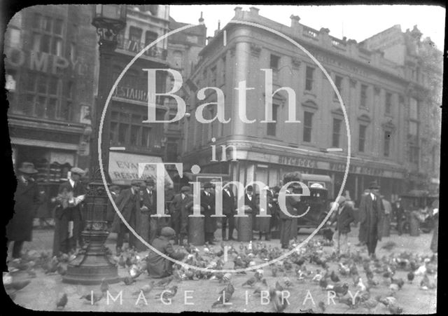 Feeding the pigeons at St. Paul's Churchyard, London c.1920