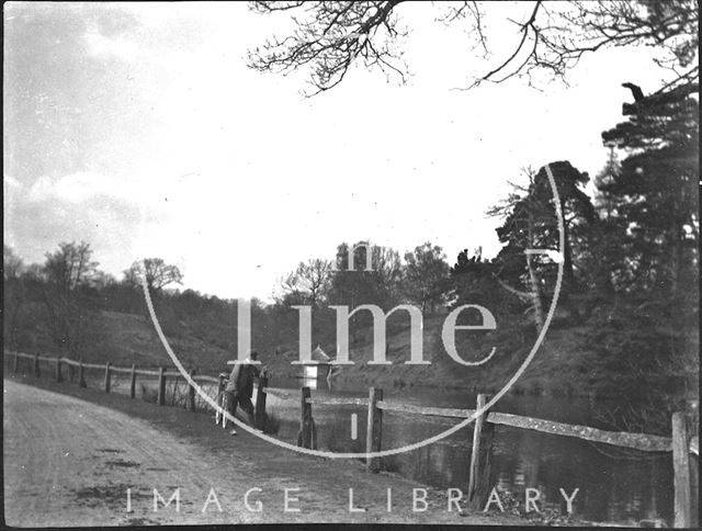 Cyclist and an unidentified lake c.1900