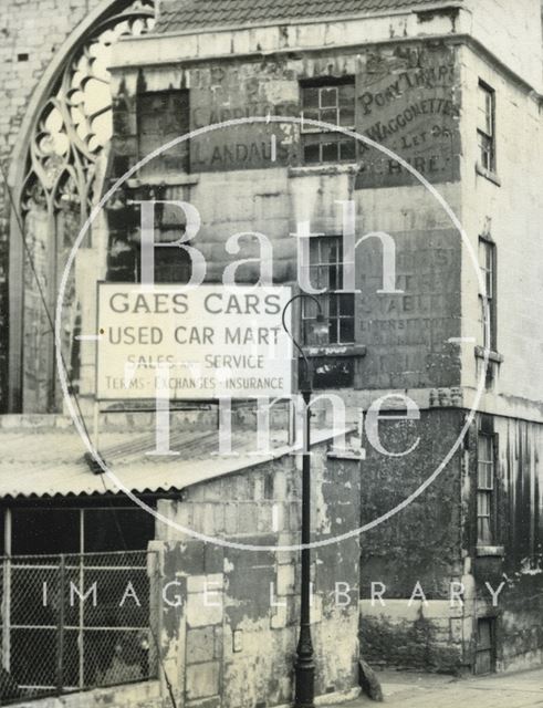 Advertisement for Gaes Cars, carriage hire on a building in James Street West, Bath c.1950