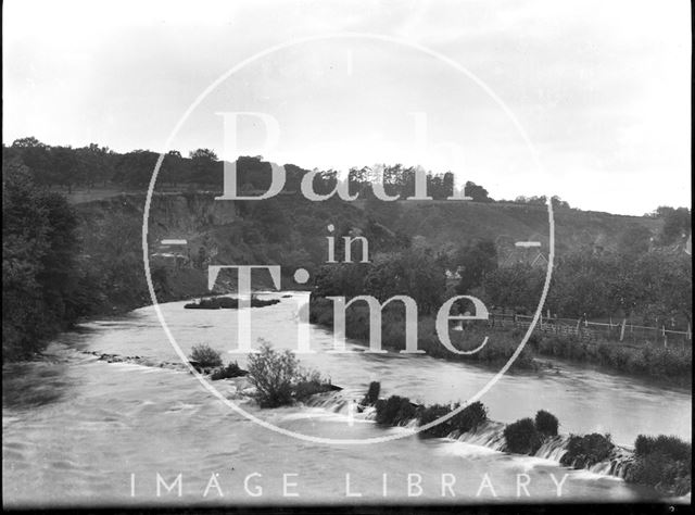 River bend and weir at an unidentified location c.1900