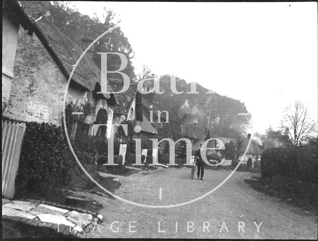 Cyclist in an unidentified village street c.1900