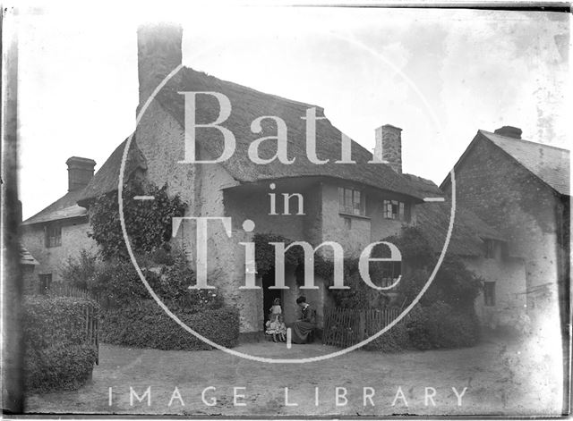 Sitting outside a thatched cottage, Minehead, Somerset c.1915