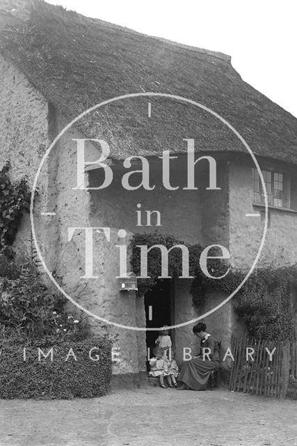 Sitting outside a thatched cottage, Minehead, Somerset c.1915 - detail