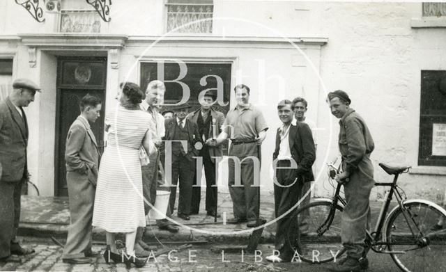 Landlord Tom Harper (holding bucket) outside the Larkhall Inn, Bath c.1950