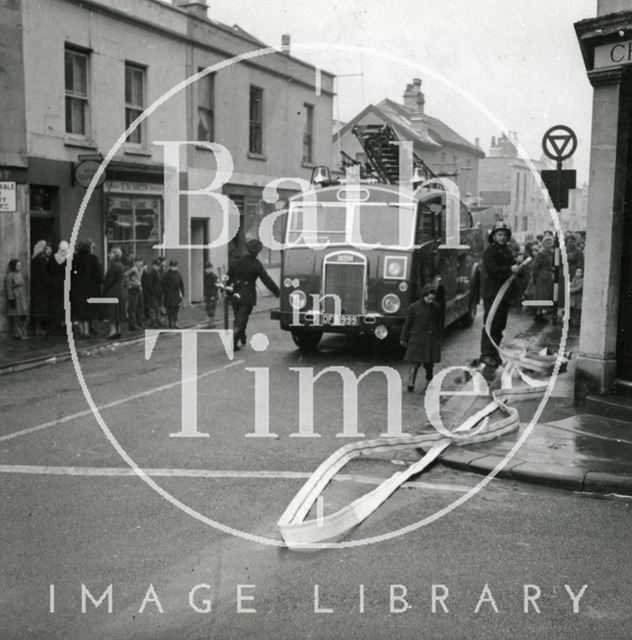 Fire engine in Larkhall pumping flood water, Bath 1956