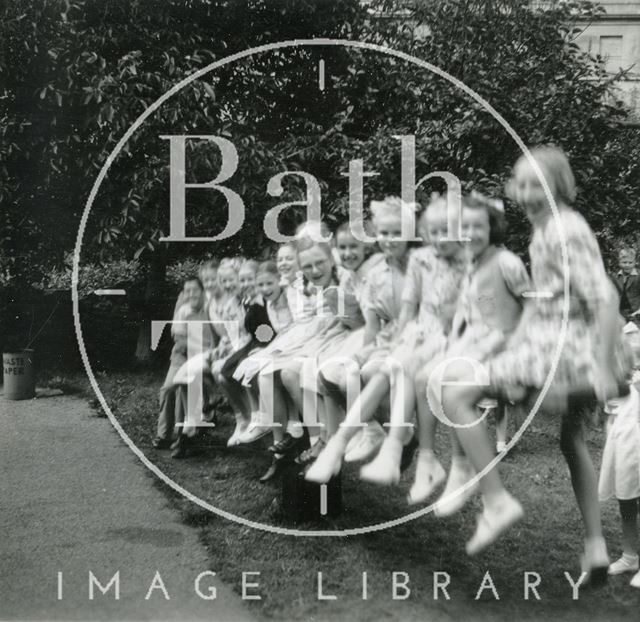 Children playing on the see-saw in the garden of the Larkhall Inn, Bath 1952