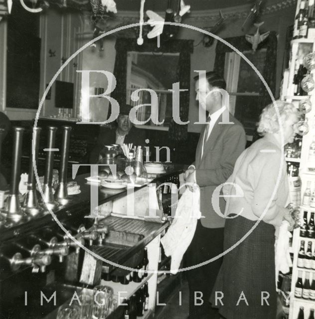 Interior of the Larkhall Inn with Ellen Harper behind the bar, Bath 1940s