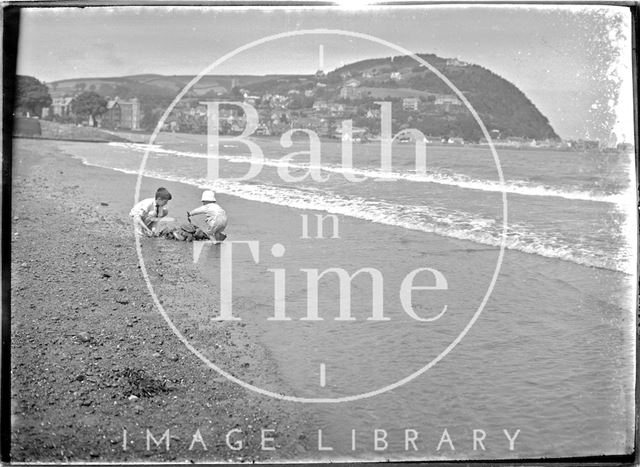 One of the photographer's twins and a friend on the beach at Minehead, Somerset 1920