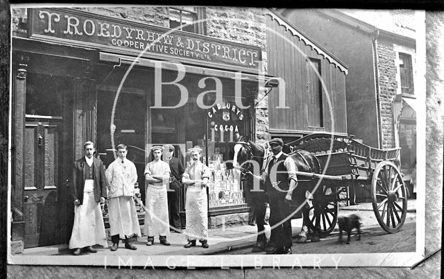 Portrait of a group of people outside Troedyrhiw & District Cooperative Society shop, Glamorgan, Wales c.1900