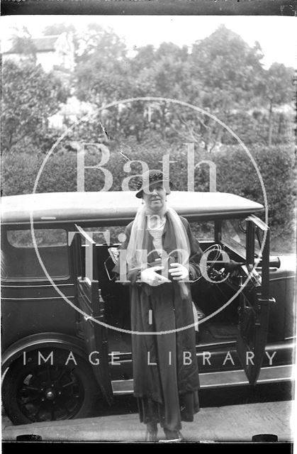 An unidentified lady and car c.1920