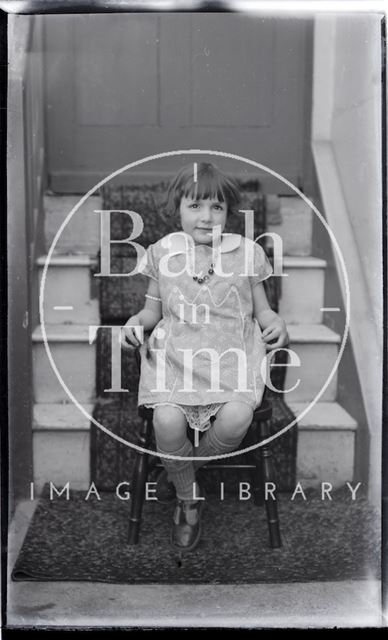 An unidentified young girl posing inside 32, Sydney Buildings, Bath c.1919