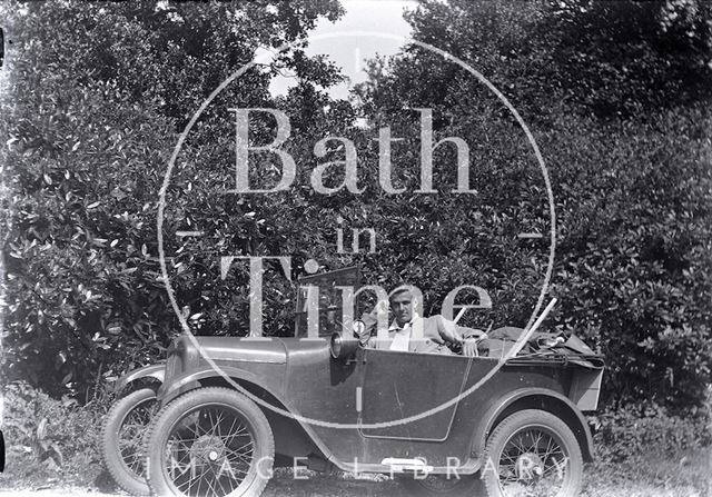 A young man in his open topped car c.1930