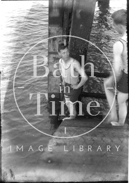 Two young men about to swim in the sea c.1930