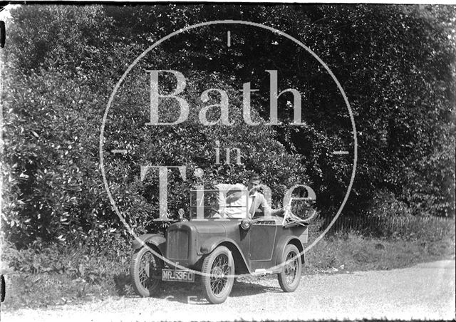 A young man in his open topped car c.1930