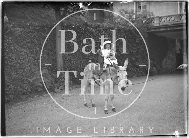 Small girl on a donkey Monkton House, Warminster Road, Limpley Stoke, Wiltshire c.1910