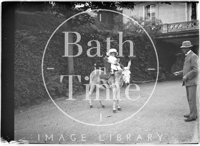 Small girl on a donkey Monkton House, Warminster Road, Limpley Stoke, Wiltshire c.1910