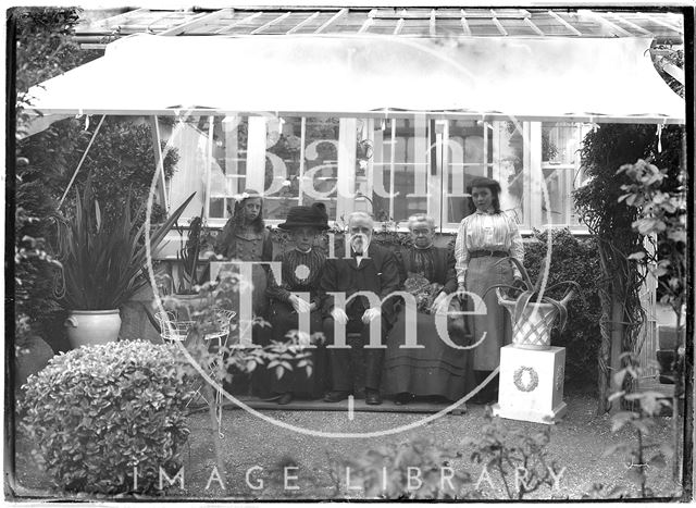 Mr. and Mrs. Unwin and family in their garden c.1910