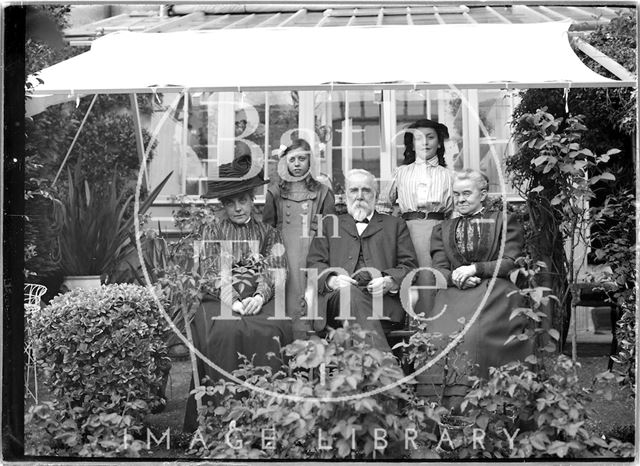 Mr. and Mrs. Unwin and family in their garden c.1910