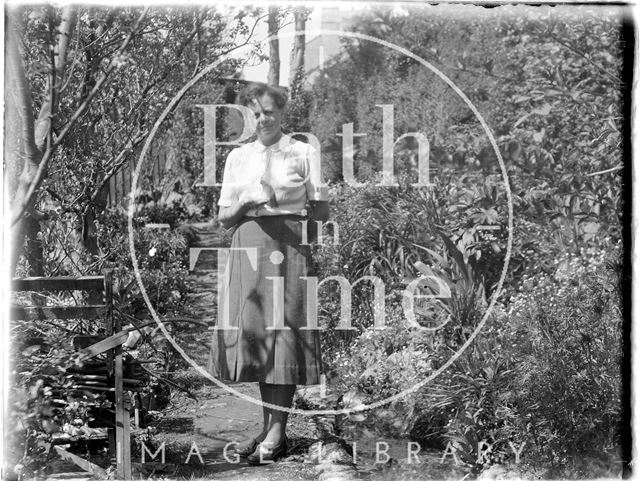 An unidentified lady in a garden c.1900