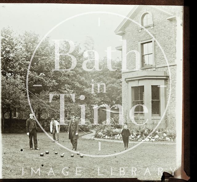 Playing lawn bowls in an unidentified garden c.1890