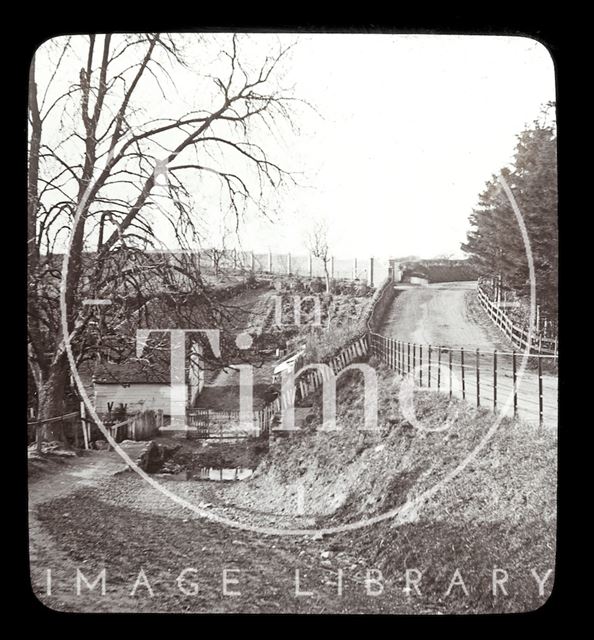 An unidentified rural lane with a turning to a ford and small bridge c.1900