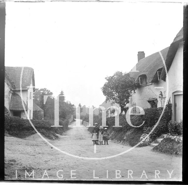 An unidentified country lane with children in the foreground c.1890