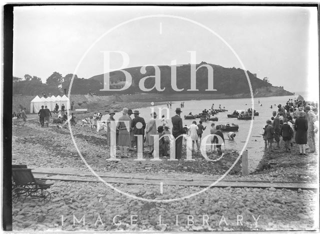 A group of spectators watching a seaside boating scene, Clevedon Beach, Somerset c.1920