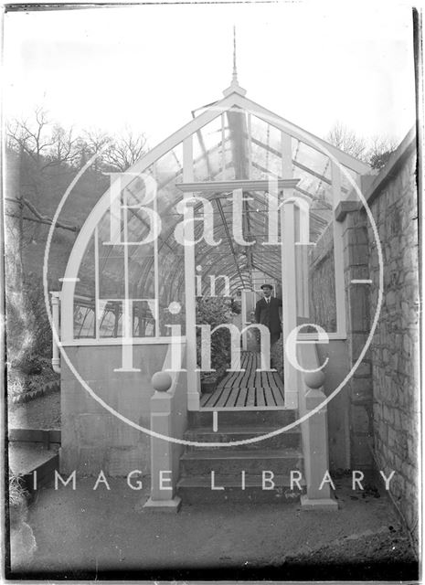 Greenhouse and gardener at Monkton House, Limpley Stoke, Wiltshire c.1910