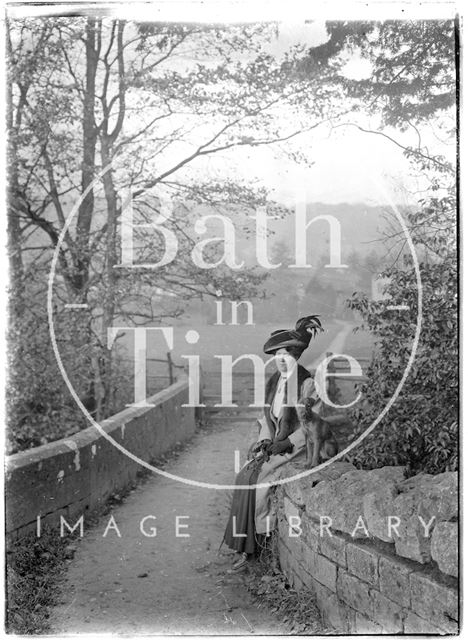 The photographer's wife Violet and their dog, on the bridge crossing the Mill Brook, Monkton Combe c.1905