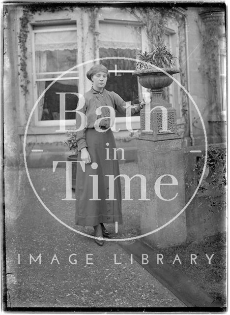 A lady posing in front of Monkton House, Limpley Stoke, Wiltshire c.1900