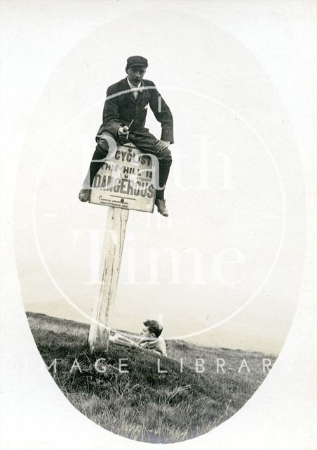 The photographer or one of his friends on a sign c.1890