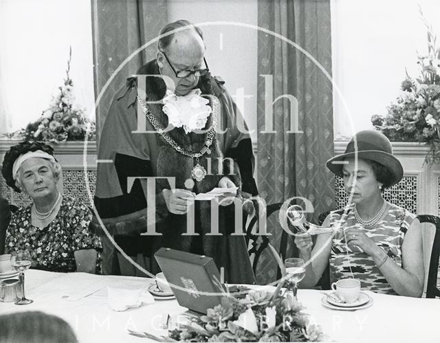 Queen holding a Saxon drinking horn presented to her by the Mayor during lunch at the Pump Room, Bath 1973