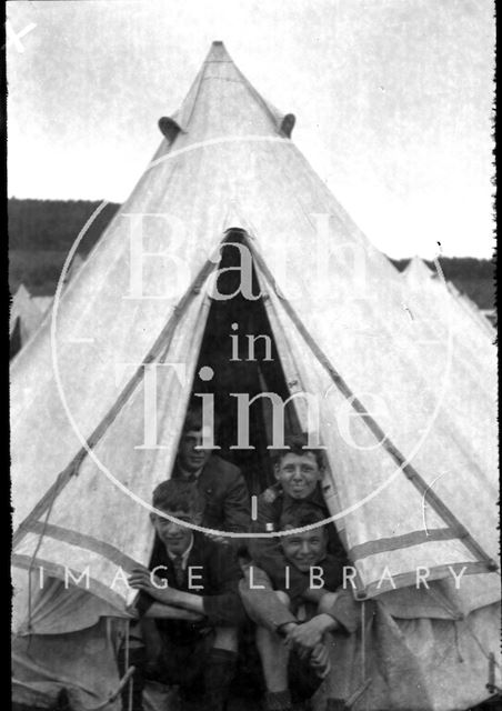 Youths in a tent at an unidentified location c.1920