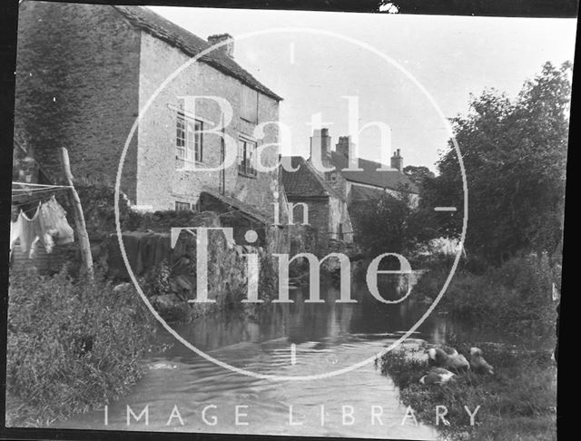 Stream and buildings in Nunney, Somerset c.1950