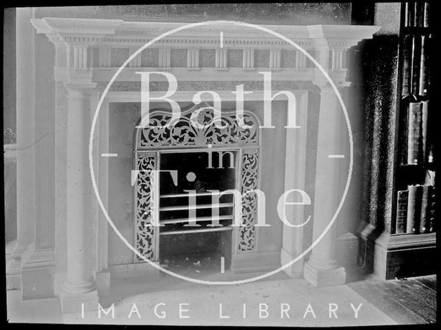 An unidentified fireplace and bookcase c.1905