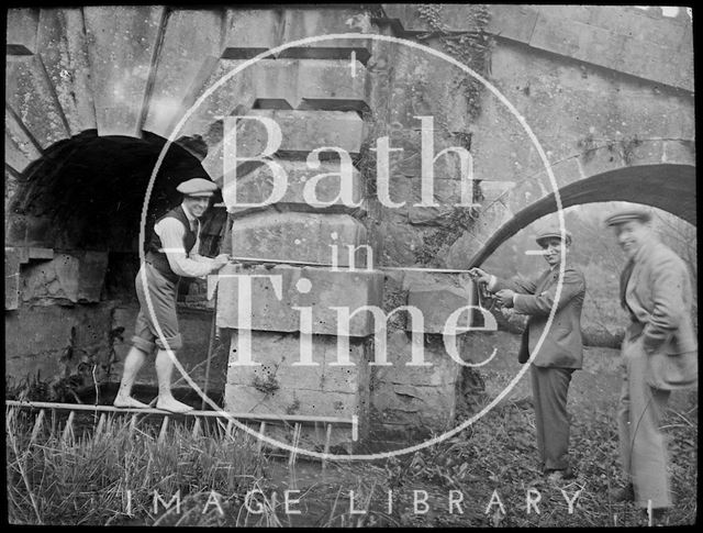 Surveyors measuring part of the Palladian Bridge, Prior Park, Bath c.1905