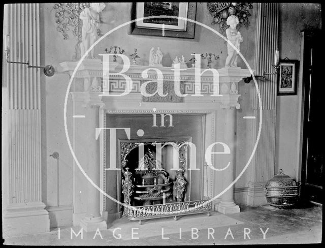 An unidentified fireplace, with cherubs and ornate wall carvings c.1905